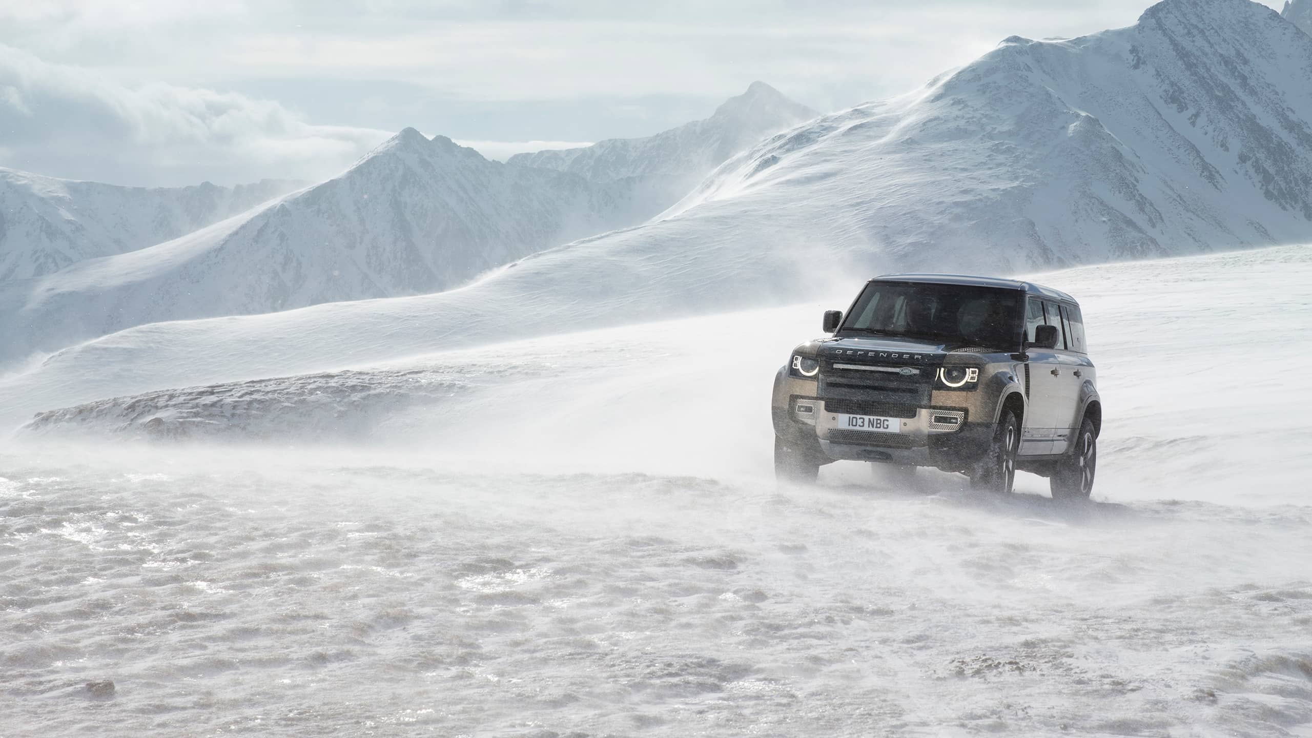 Defender on a snowy mountain
