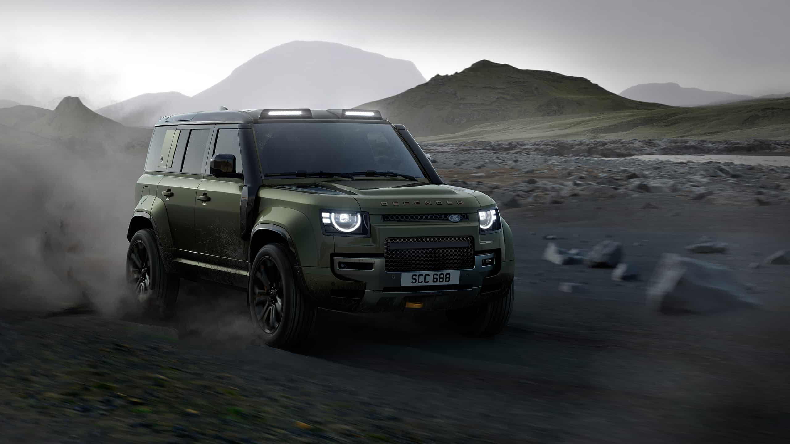 Defender runninng on sand dust road