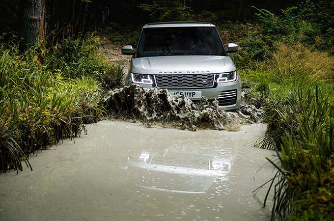 Range Rover driving through water