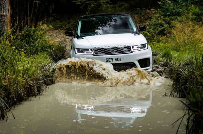 Range Rover driving through water